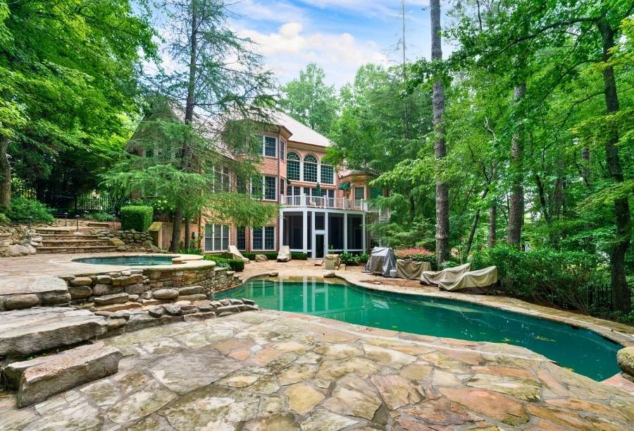 Home with Pool Surrounded by Trees