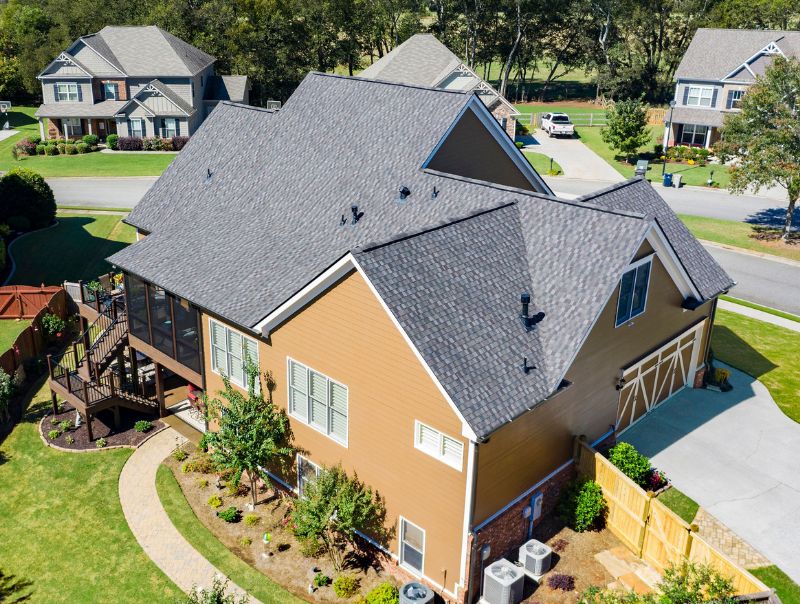 Aerial View Of A Large Suburban Home With A Deck