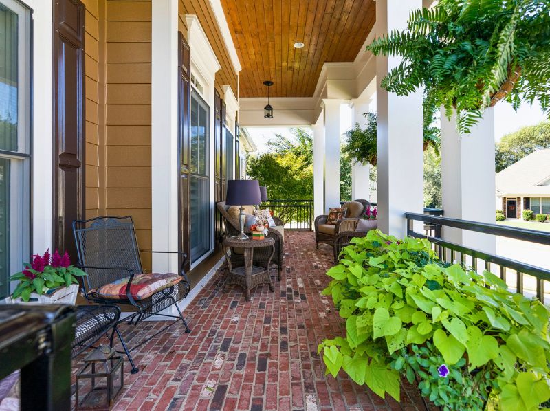 Cozy Porch With Seating And Plants