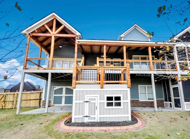 Two-story House With Wooden Deck And Railing